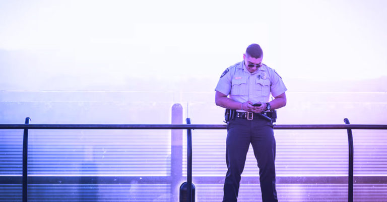 Security guard on his phone