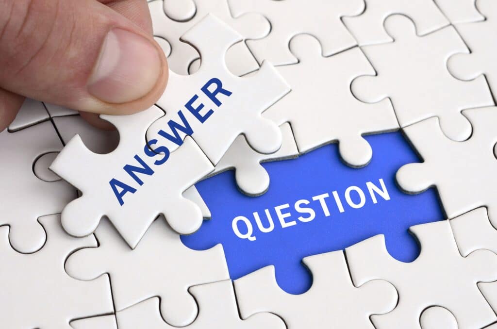 Puzzle pieces labeled "Answer" and "Question" representing organizations seeking evidence-based security answers about exploitability and cyber risk.