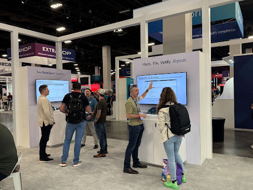 Fal.Con attendees watching a NodeZero autonomous pentesting demo at the Horizon3 booth